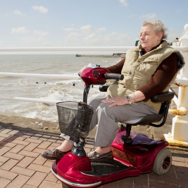 Bucket-woman-on-a-mobility-scooter-at-the-beach