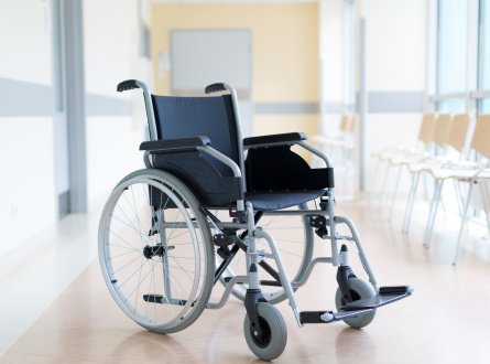 A wheelchair inside of a hospital.