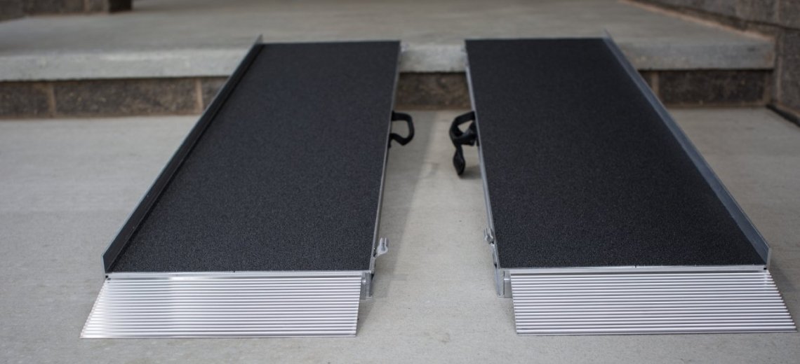 A Suitcase® Singlefold portable ramp installed on a step