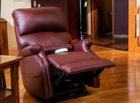 A brown power lift chair recliner on a living room