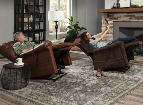 A couple taking a selfie while they are sitting on their own lift chairs with patented Twilight Technology